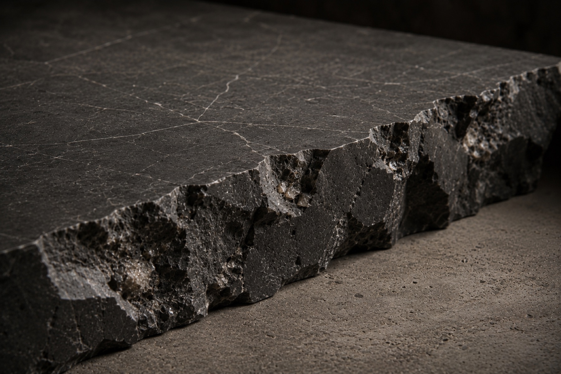 A cut block of dark stone